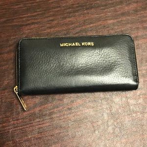 Michael Kors authentic black leather wallet.